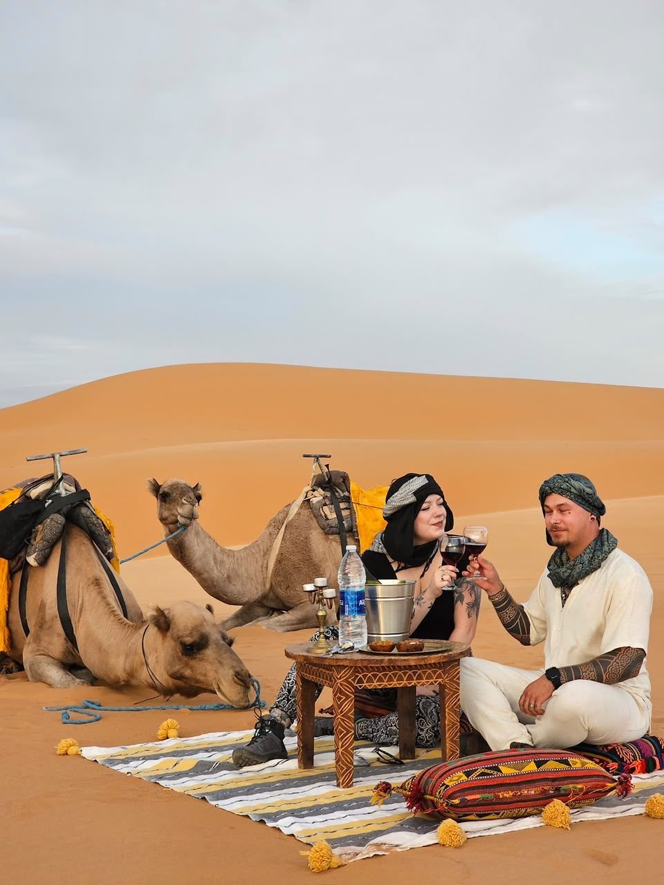 What to pack for the Sahara desert: travellers on the Merzouga dunes